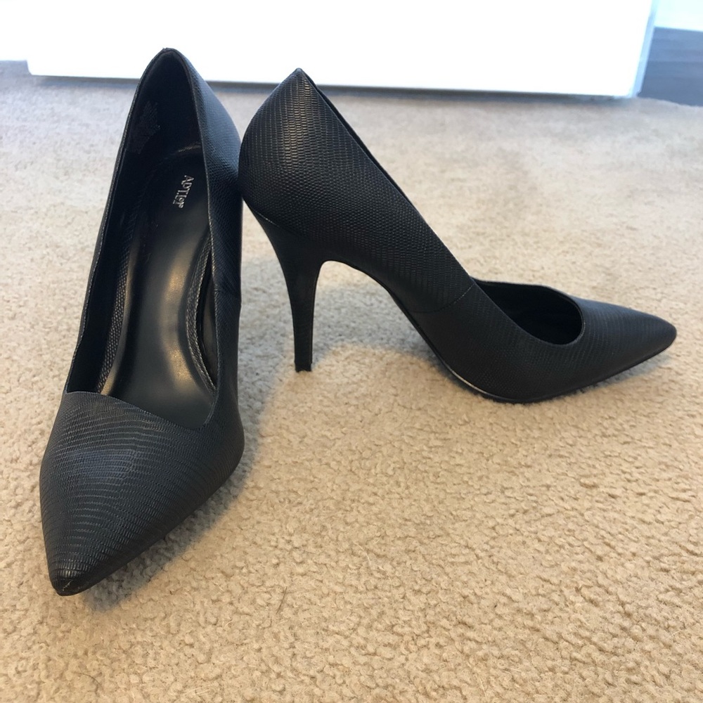 Black pointed toe pumps